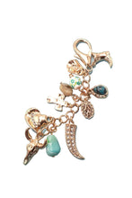 Load image into Gallery viewer, Multicolored bag charm/ keychain pendant on a turquoise background