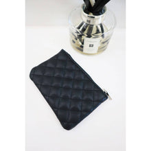 Load image into Gallery viewer, Black quilted faux leather mini zip pouch with zipper closure on white background