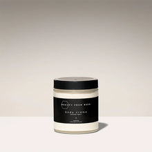 Load image into Gallery viewer, Jar of body crème with black lid and label on a light background