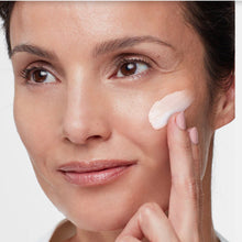 Load image into Gallery viewer, Woman applying Hydropeptide SPF to her face with a white background