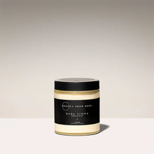 Load image into Gallery viewer, Jar of body crème with black lid and label on a light background