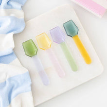 Load image into Gallery viewer, The Sorbet Glass Dessert Spoons pastel glass spoon set in yellow, lavender, mint, and pink displayed on soft white fabric background
